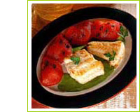 Filets de merlan aux tomates braises sur un coulis de persil