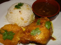 CUISSES DE POULET A L  ORANGE ET AU CURRY